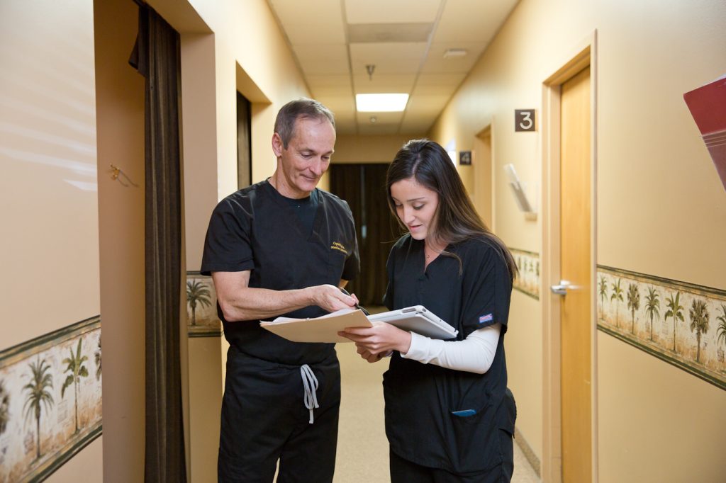 Dr. Lewis talking to nurse