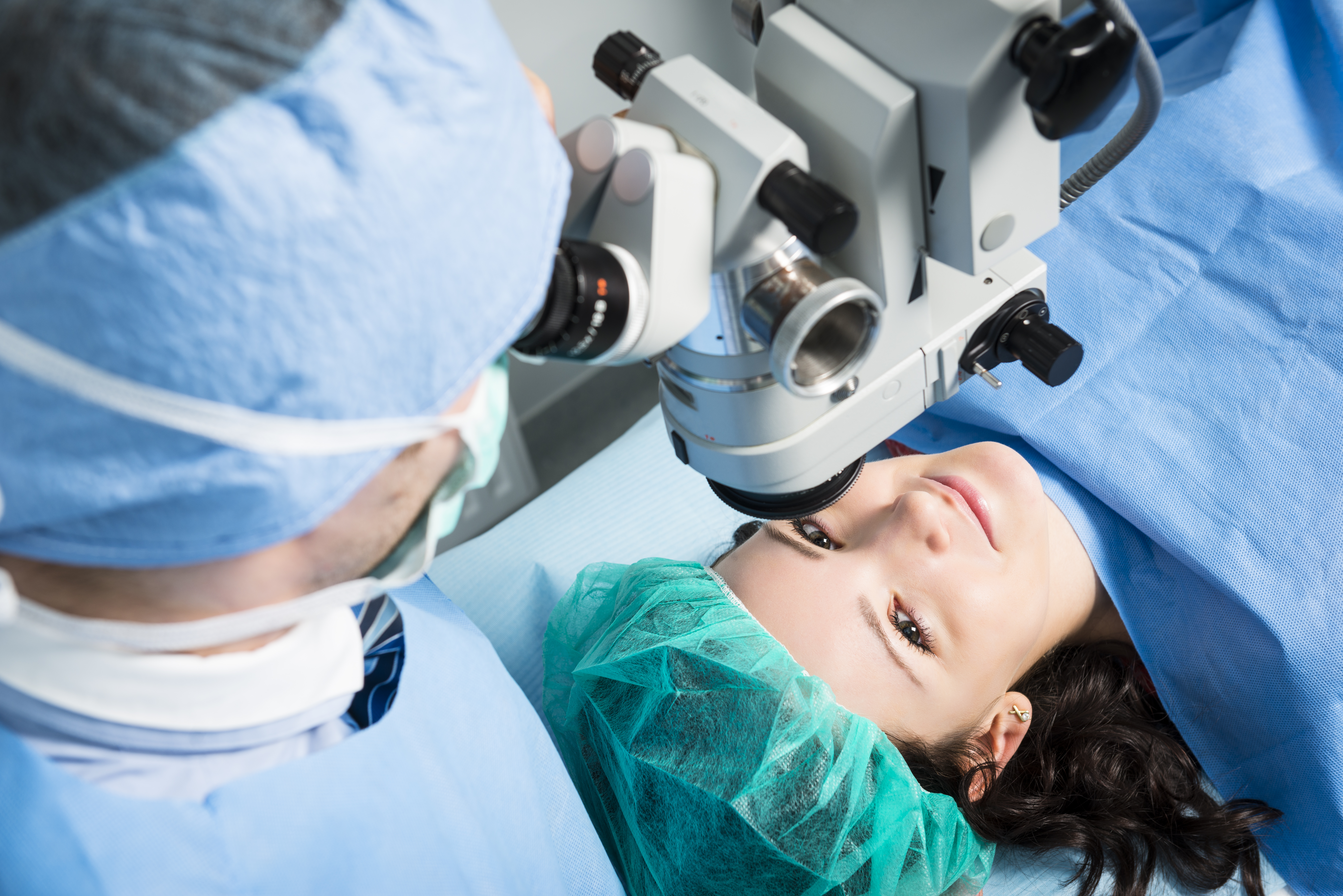 Surgeon preparing for operating on a patient using a microscope